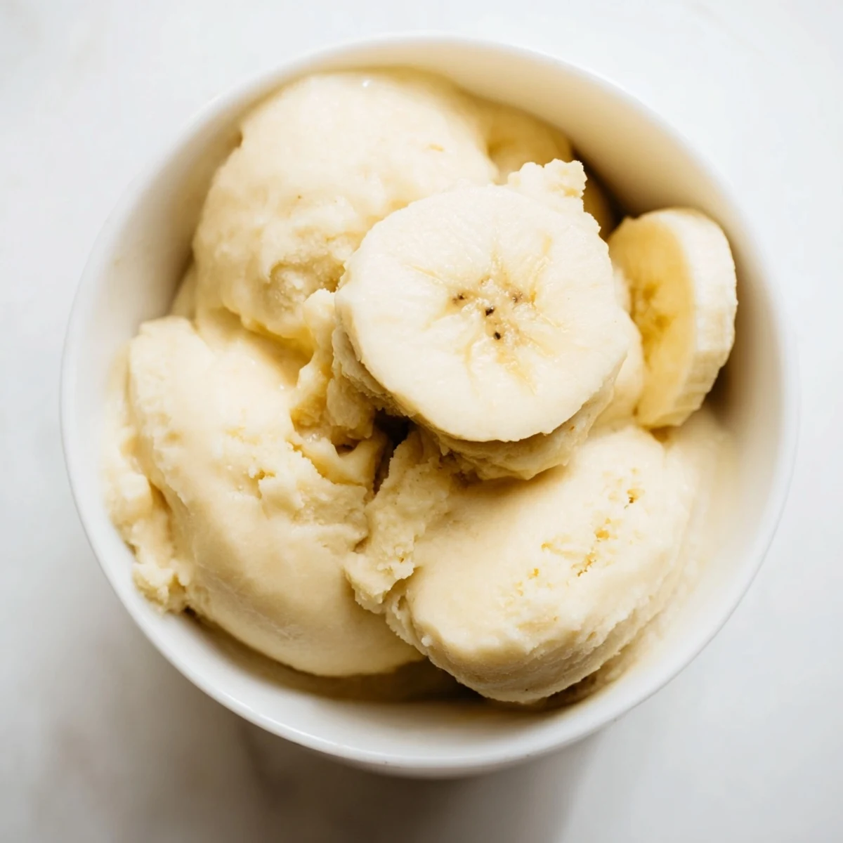 Homemade 2-Ingredient Banana Ice Cream, a cool and refreshing treat with just bananas and milk.