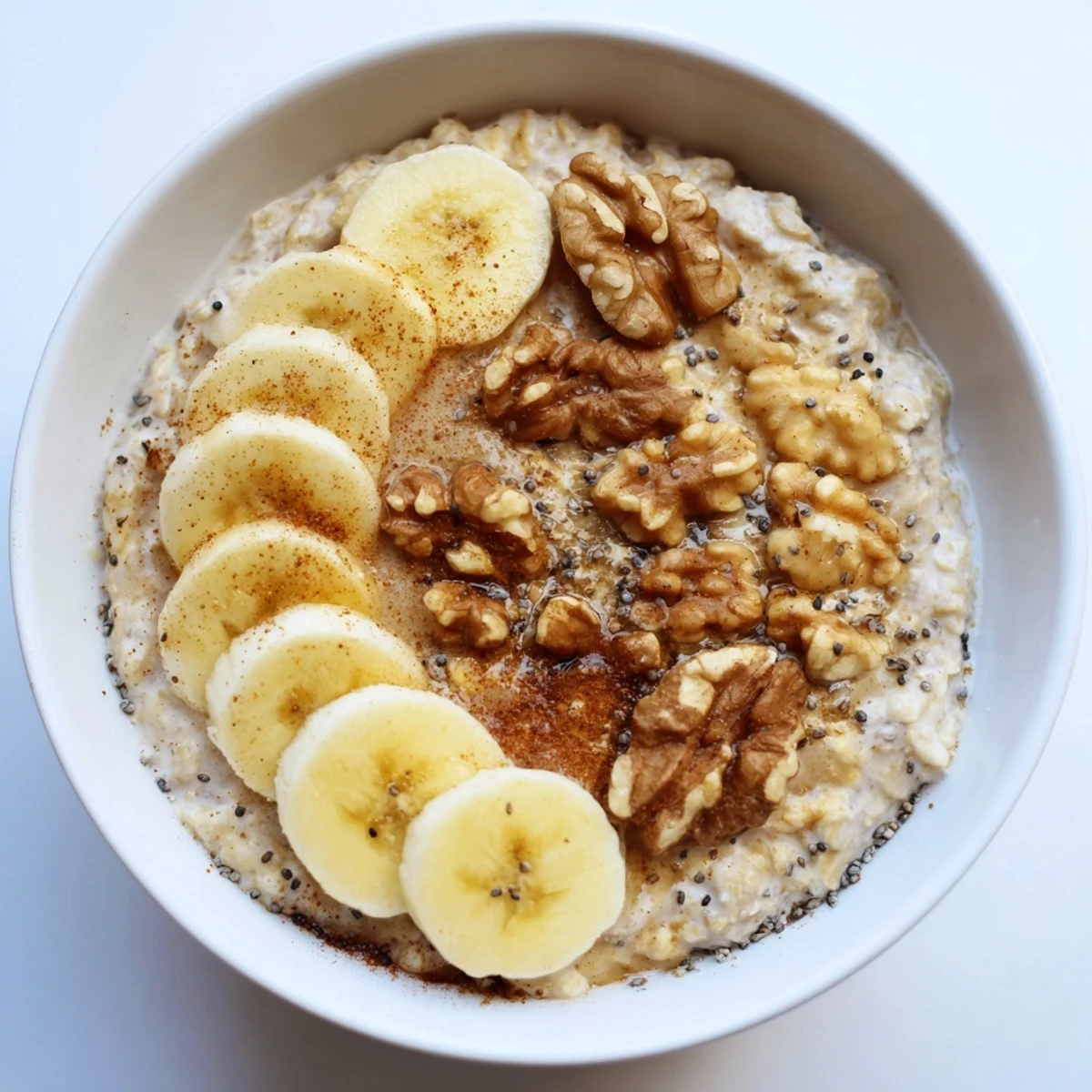 A visually appealing bowl of microwave banana oats, showing the creamy texture and sweet banana.