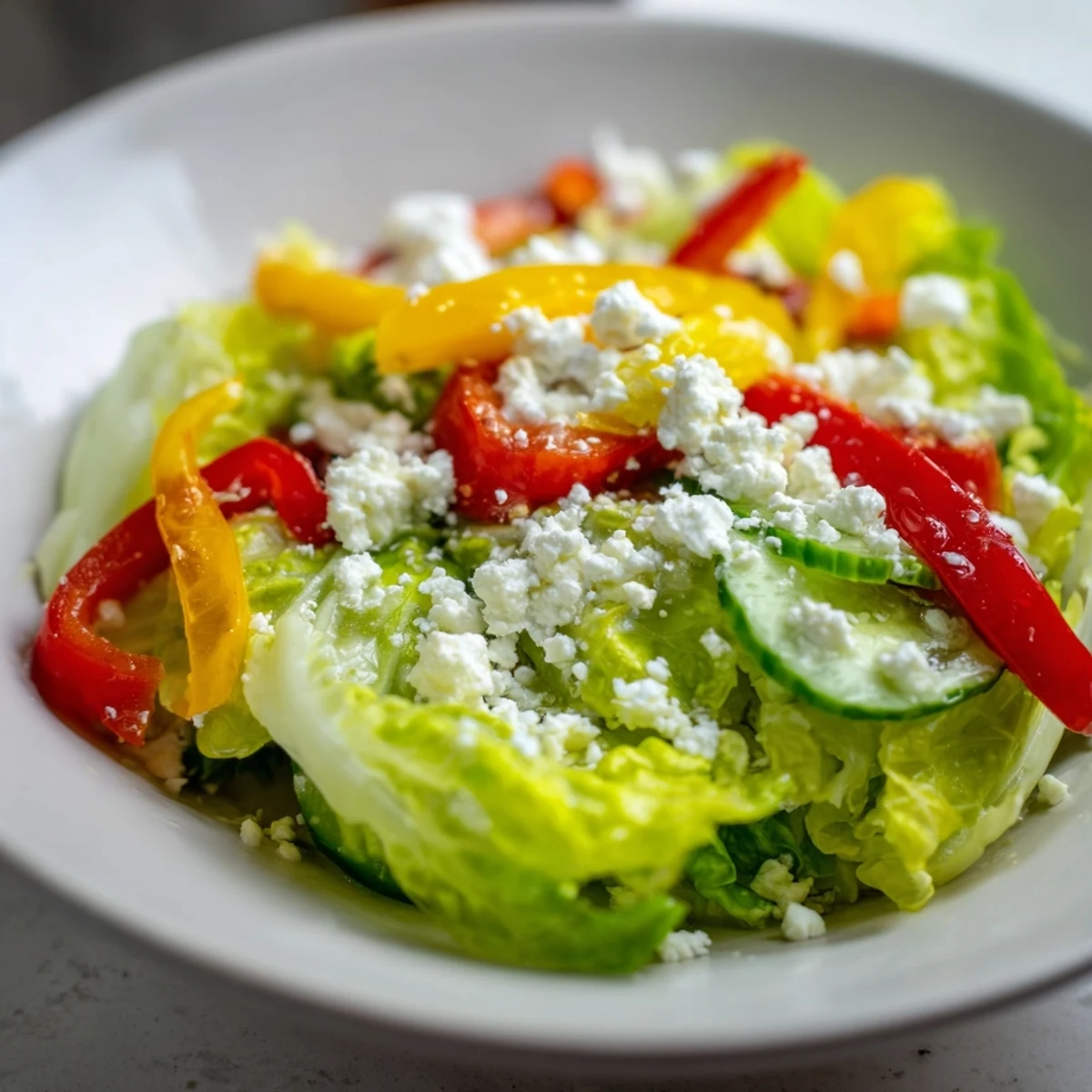 A vibrant Bella Hadid Salad with colorful veggies and creamy feta, ready to enjoy.