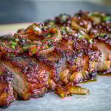 Roasted Pork and Aromatic Rhubarb Traybake served with fresh herbs and warm spices.