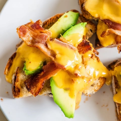 Golden, buttery sourdough slices encase crispy bacon, ripe tomato, fresh lettuce, creamy avocado, and melted cheddar in this Avocado BLT Grilled Cheese.  