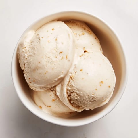Freshly made 2-Ingredient Banana Ice Cream, light tan, ready to be scooped and enjoyed right now.