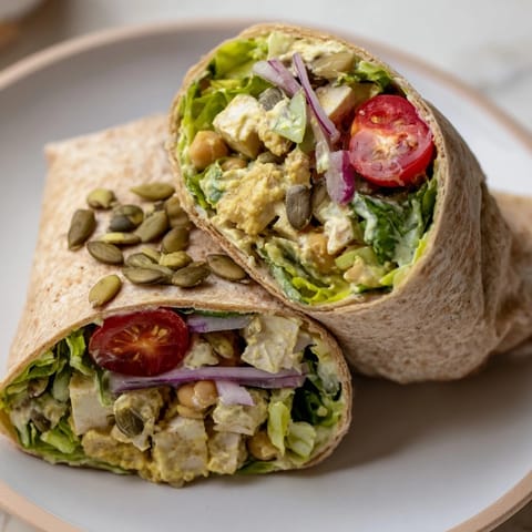 Freshly-made High-Protein Chicken-less Caesar Wrap, bursting with colorful veggies and a flavorful plant-based filling.