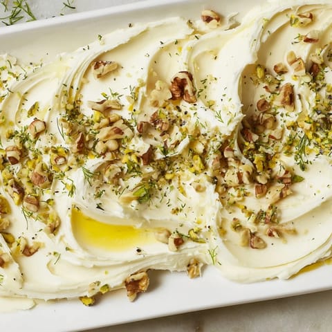 A close-up of Flavored Butter Board Charcuterie with rustic bread and prosciutto, perfect for entertaining and sharing.
