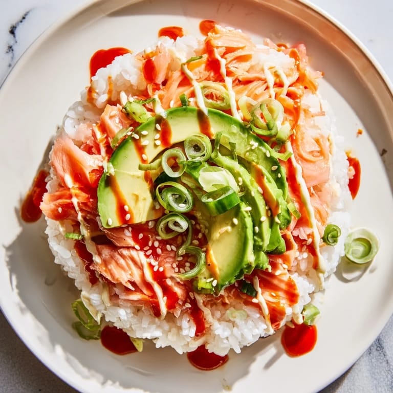 Imagine a vibrant bowl: creamy Japanese mayo complements the delicious Classic Salmon Rice's flavorful components.