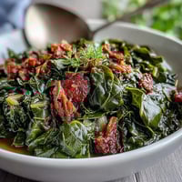 Smoky collard greens with tender turkey and onions, simmered to perfection in a rich Southern-style broth.