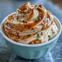 Homemade Chipotle Lime Mayonnaise in a glass jar, creamy and golden with flecks of smoky chipotle and fresh lime zest.