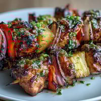 Grilled pineapple chicken skewers with juicy chicken and sweet pineapple chunks, perfect for summer cookouts.  