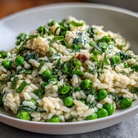 Creamy Spring Pea Risotto with fresh peas and mint, perfect for a spring Italian dinner.